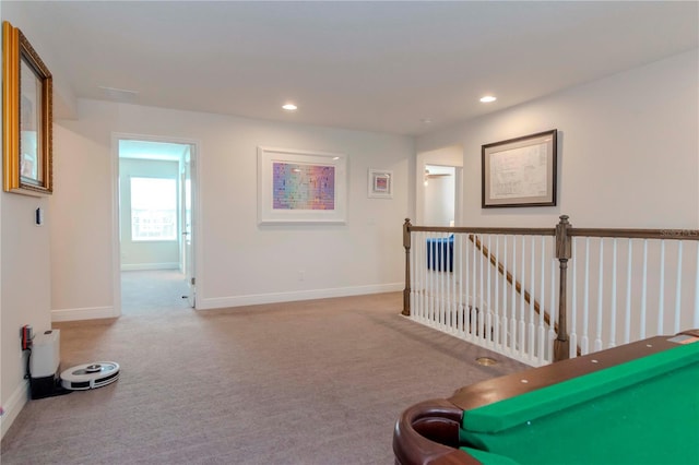 interior space featuring an upstairs landing, recessed lighting, baseboards, and carpet floors