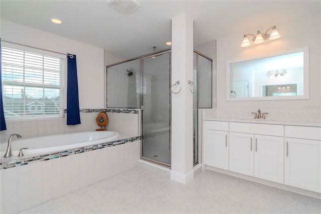 bathroom featuring tile patterned flooring, a shower stall, a bath, and vanity