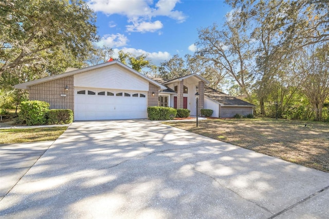 ranch-style house featuring a garage