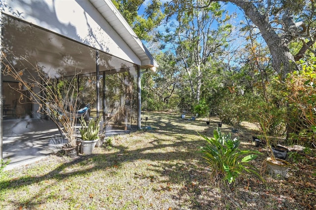 view of yard with a sunroom