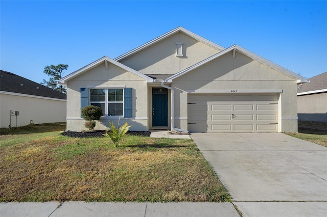 ranch-style home featuring a front lawn and a garage