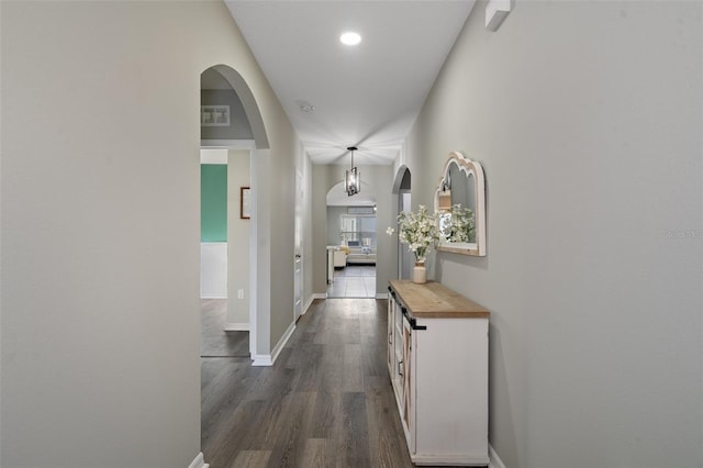 hall with dark wood-type flooring