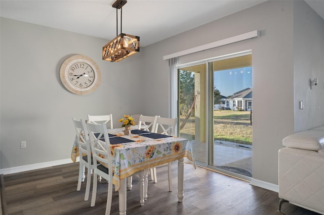 dining room with dark hardwood / wood-style flooring