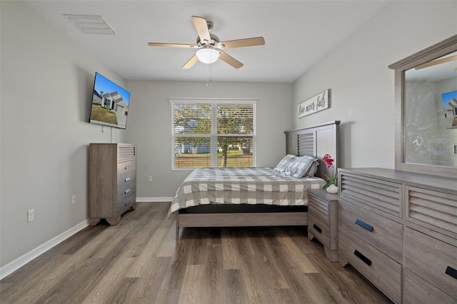 bedroom featuring ceiling fan and hardwood / wood-style flooring