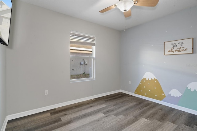 spare room featuring hardwood / wood-style flooring and ceiling fan