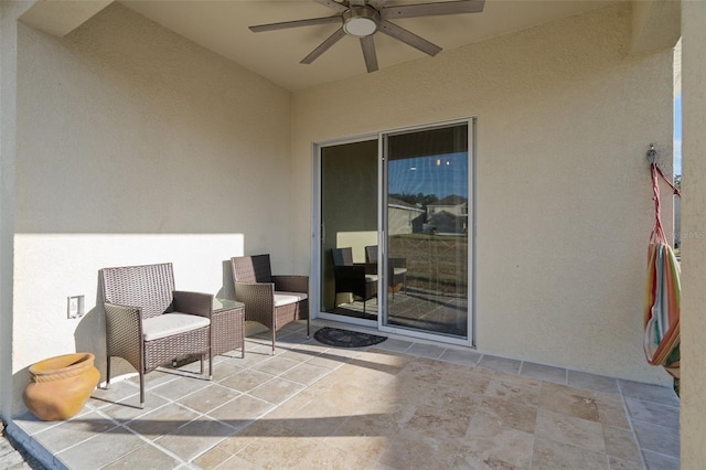 view of patio / terrace featuring ceiling fan