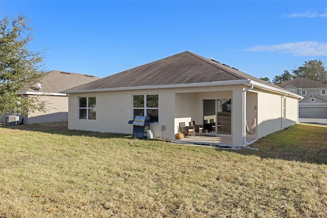 back of house featuring a lawn