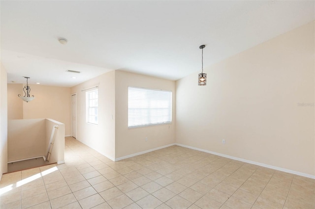 empty room featuring light tile patterned floors