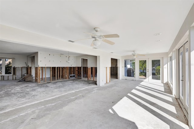 interior space featuring ceiling fan and french doors