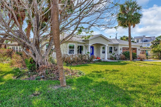 ranch-style house with a front yard and a garage