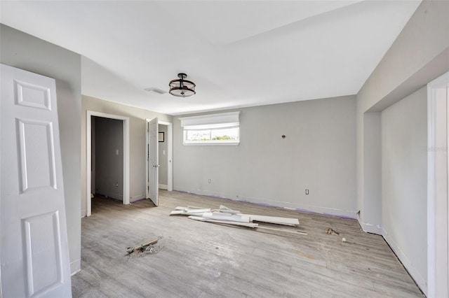 unfurnished bedroom with light hardwood / wood-style flooring