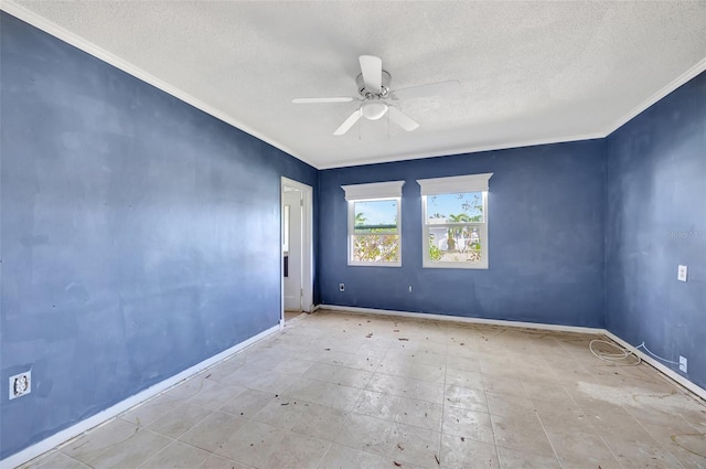 spare room featuring ceiling fan, a textured ceiling, and ornamental molding