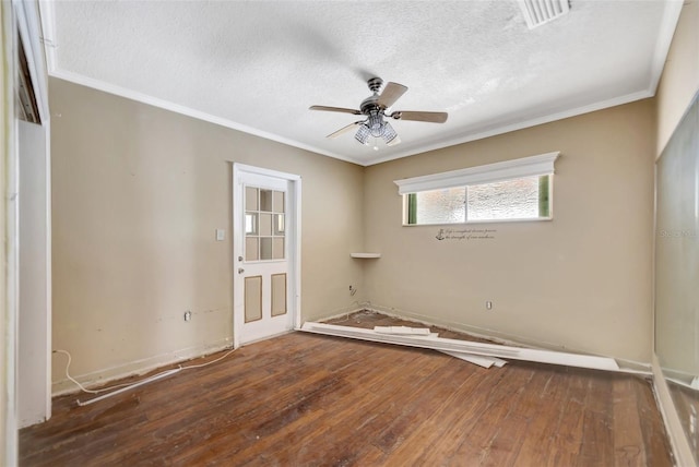 unfurnished room featuring hardwood / wood-style floors, a textured ceiling, ceiling fan, and ornamental molding