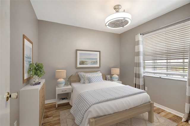 6923 Stonesthrow Cir N Unit 4105, Saint Petersburg, FL 33710 - bedroom with wood finished floors and baseboards