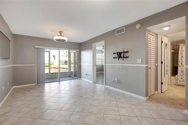 6923 Stonesthrow Cir N Unit 4105, Saint Petersburg, FL 33710 - unfurnished room featuring light tile patterned flooring and a smoke detector