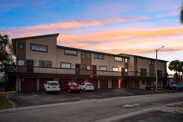 view of outdoor building at dusk