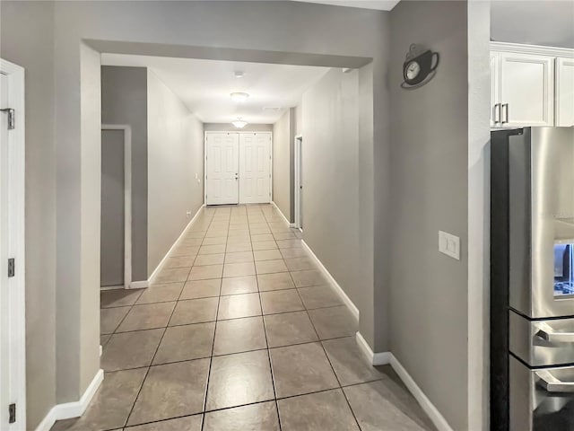 hallway featuring light tile patterned floors