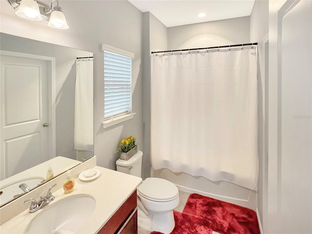 full bathroom with shower / bath combo, vanity, and toilet