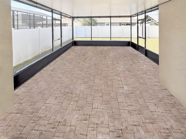 unfurnished sunroom featuring a healthy amount of sunlight