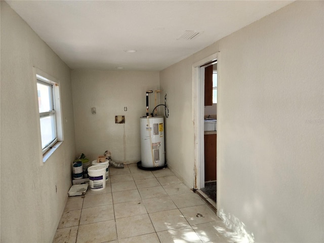 utility room featuring electric water heater