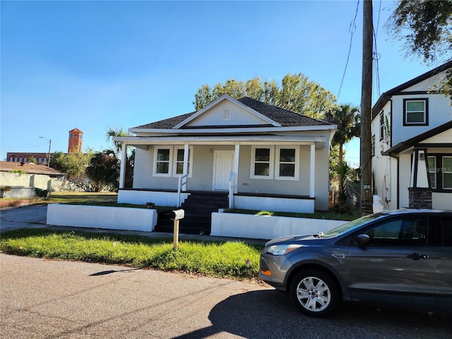 bungalow-style house featuring covered porch