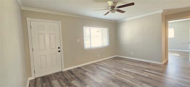 unfurnished room with hardwood / wood-style floors, plenty of natural light, and crown molding