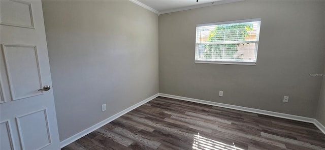 empty room with dark hardwood / wood-style floors and ornamental molding