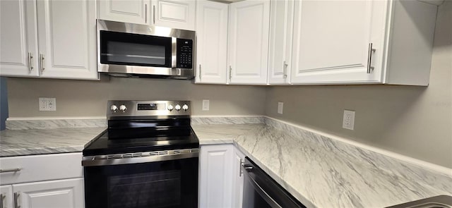 kitchen featuring white cabinetry and stainless steel appliances