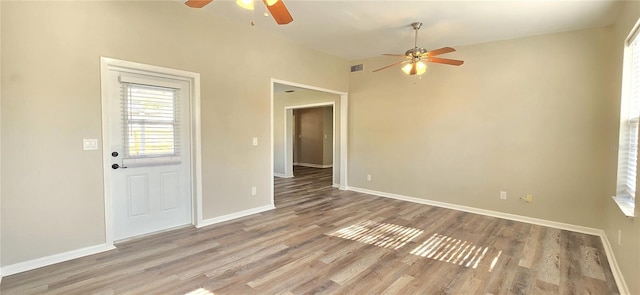 empty room with wood-type flooring and ceiling fan