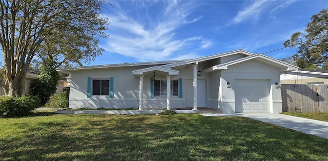 view of front of property with a garage and a front yard