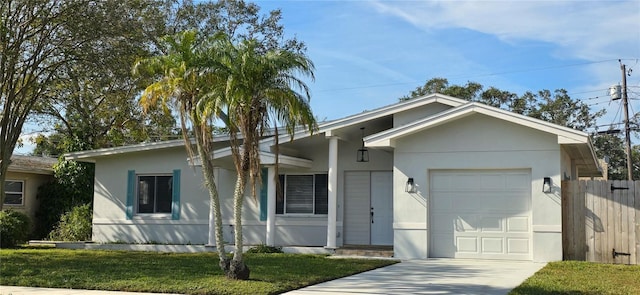 single story home featuring a garage and a front yard