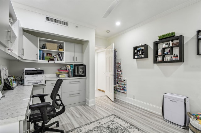 office area with recessed lighting, visible vents, baseboards, light wood-type flooring, and crown molding