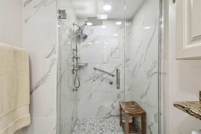 full bath with a marble finish shower