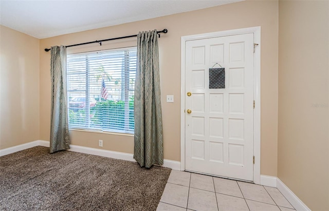 entrance foyer featuring light tile patterned floors