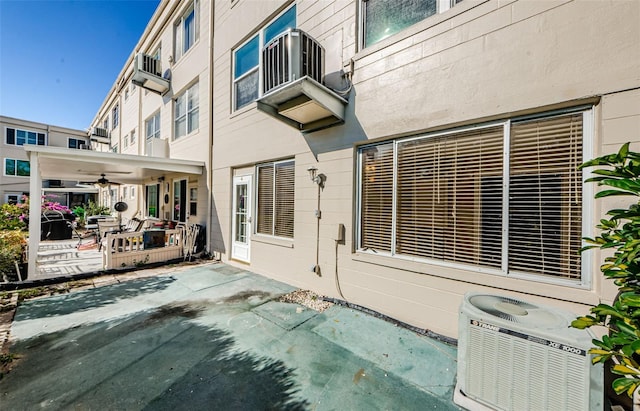 exterior space with central AC and ceiling fan