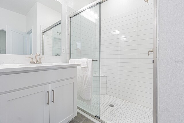 bathroom with vanity and walk in shower