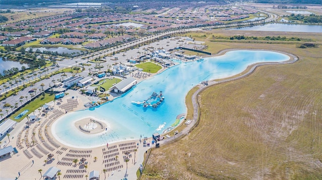 bird's eye view featuring a water view and a view of the beach