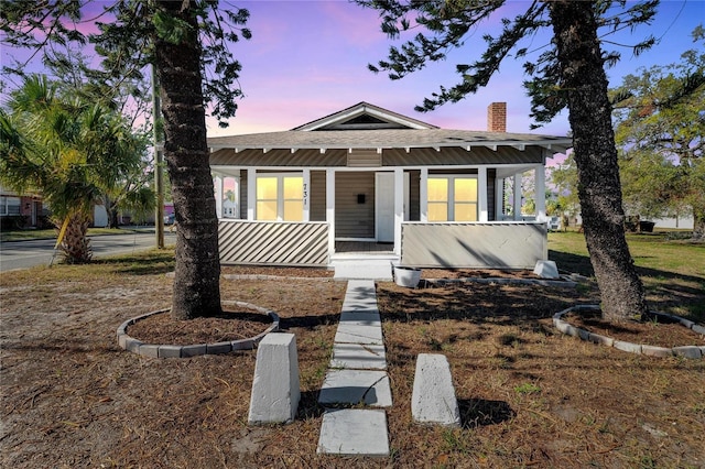 bungalow-style home with a porch