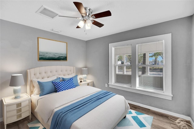 bedroom featuring hardwood / wood-style flooring and ceiling fan