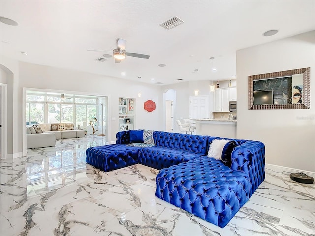 living room featuring ceiling fan