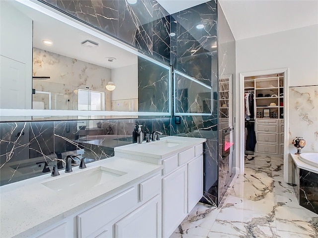 bathroom with plus walk in shower, vanity, tile walls, and backsplash