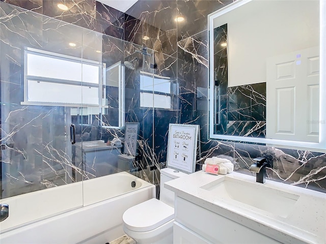 full bathroom with tasteful backsplash, enclosed tub / shower combo, toilet, vanity, and tile walls