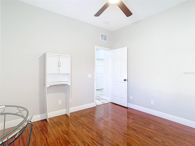 interior space featuring a closet, ceiling fan, and hardwood / wood-style floors