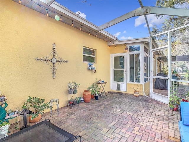 view of patio / terrace with a lanai