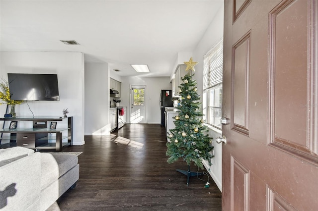 entrance foyer with dark hardwood / wood-style floors