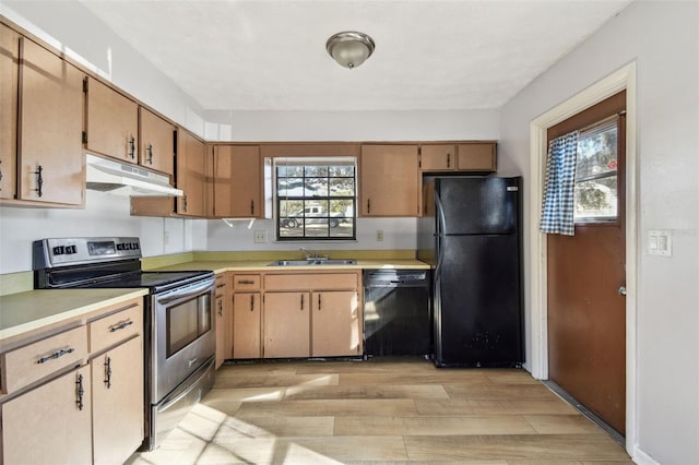 kitchen with sink, black appliances, and light wood-type flooring