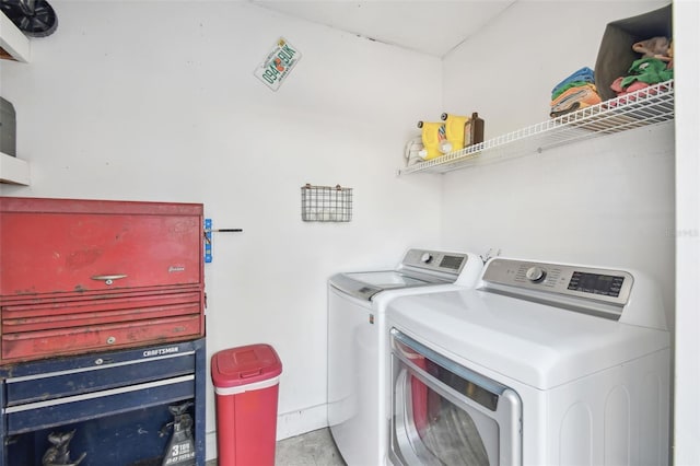 washroom with independent washer and dryer