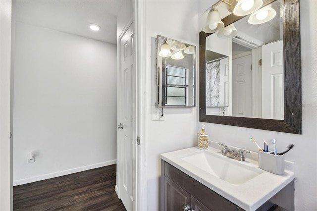 bathroom with hardwood / wood-style flooring and vanity