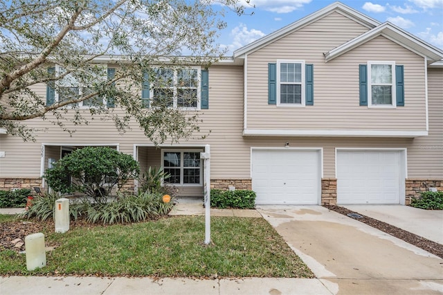 multi unit property featuring a garage