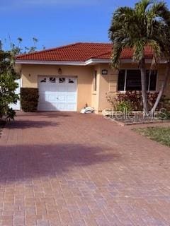 view of front of property with a garage